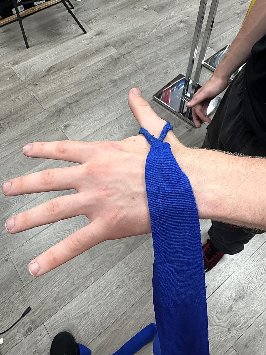 Step 1: Place the thumb loop over your thumb before wrapping your boxing hand wraps